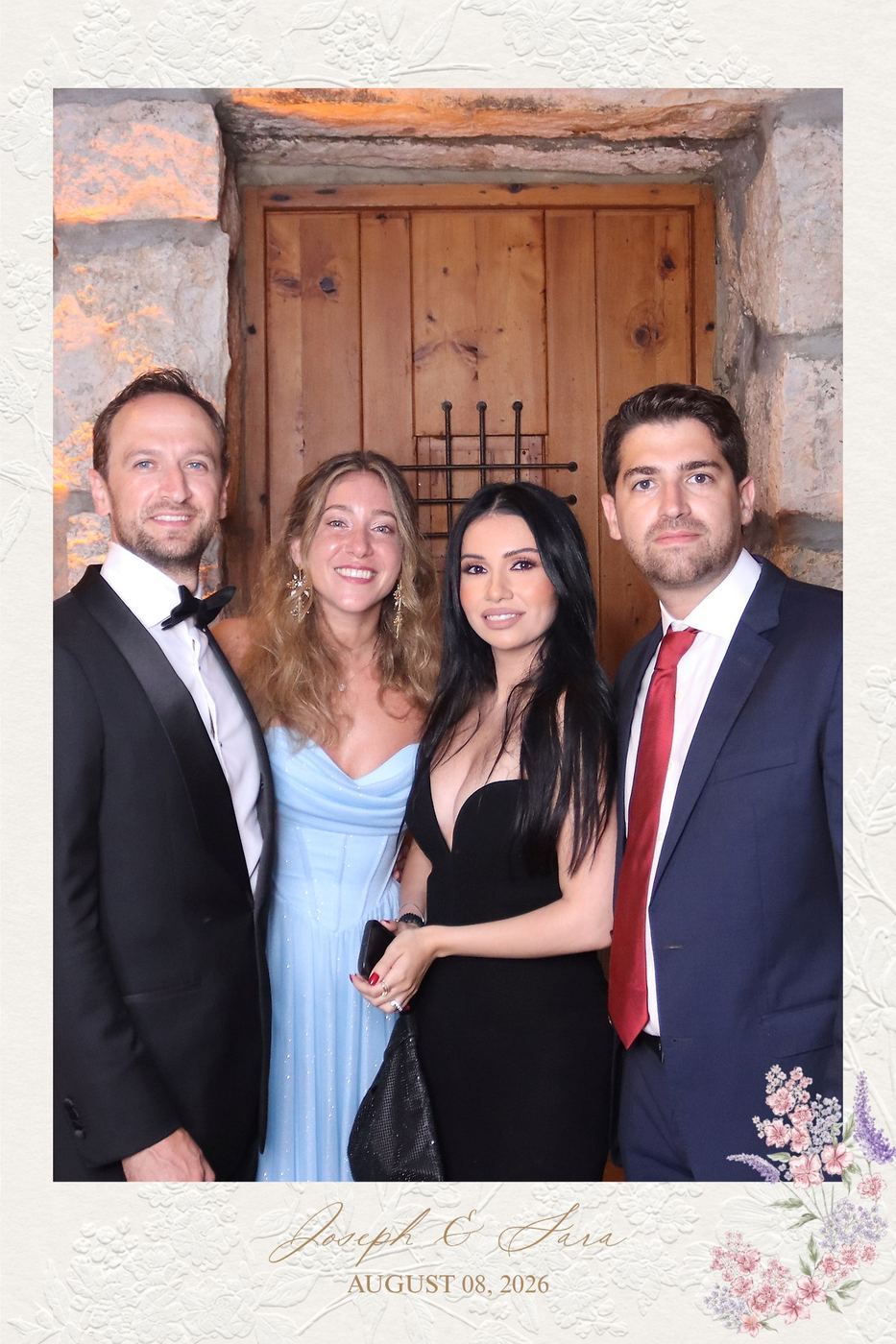 Guests in evening wear at an elegant stone venue