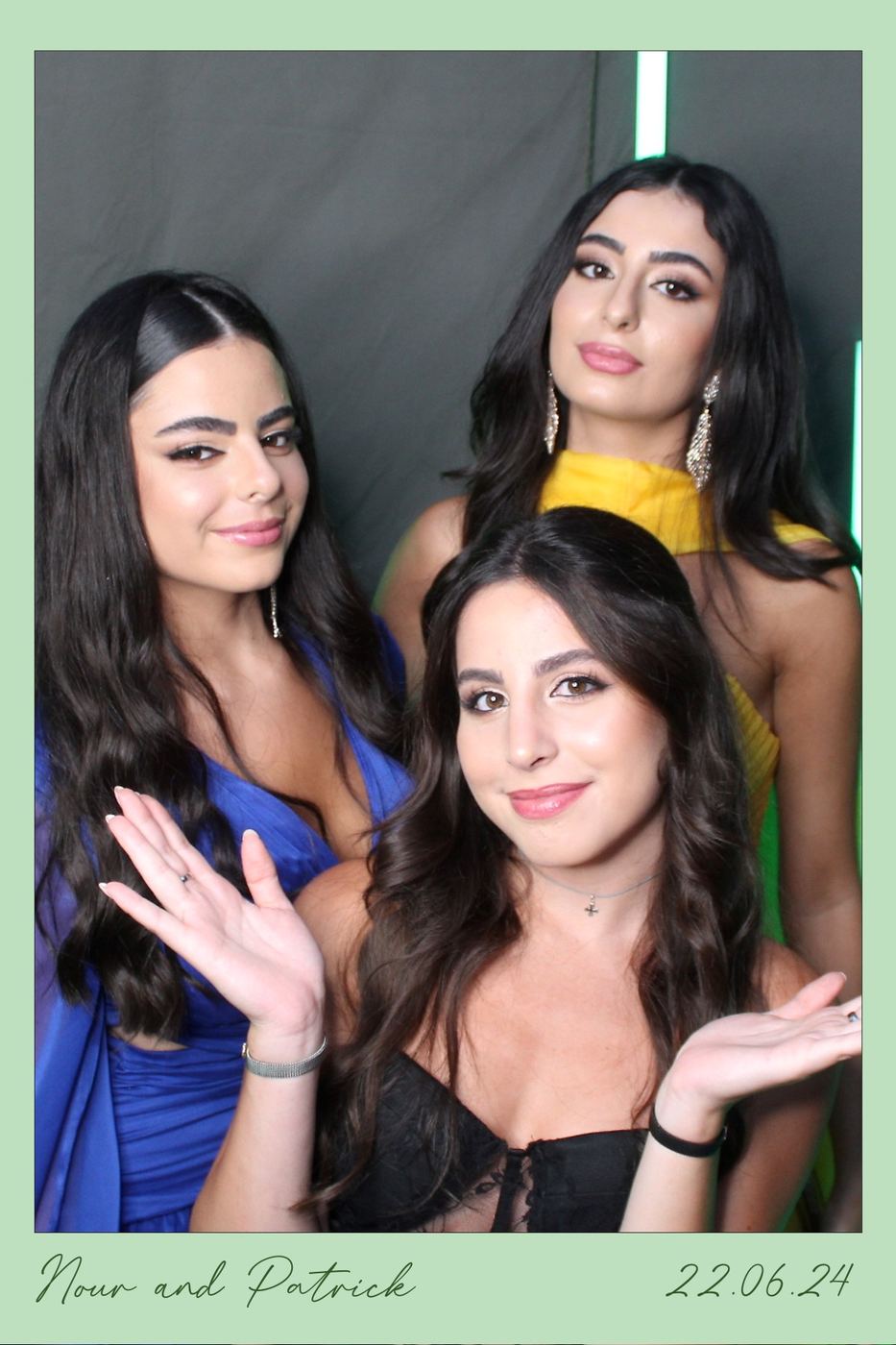 Friends striking a pose in the photobooth